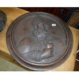 A 19th Century carved oak panel depicting St, Augustine,
