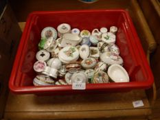 A box containing a large quantity of various china trinket boxes and enamel trinket boxes by