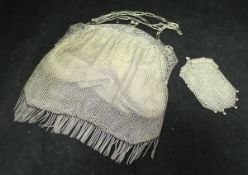 A George V silver mounted chainmail evening purse (London 1914) together with a similar purse with