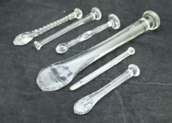 A collection of six various 19th Century glass suger crushers and a late 18th / early 19th Century