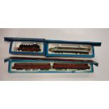 A Märklin Rail car (3076), boxed, a Rail Zeppelin (3077), boxed and a DB engine (3096),