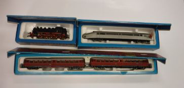 A Märklin Rail car (3076), boxed, a Rail Zeppelin (3077), boxed and a DB engine (3096),