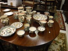 A collection of Bell Pottery wares decorated with hares, birds, etc, including jugs,