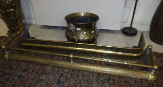 A 19th Century embossed brass baluster shaped jardinier in the Dutch style with brass lion mask