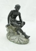 A circa 1900 Continental patinated bronze figure study of Mercury seated upon a rock,