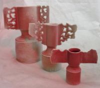 A matched graduated set of winged porcelain vases in a dappled pink ground by Colin Pearson