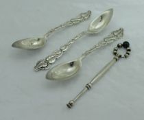 A set of three late 19th Century Tiffany grapefruit spoons with cast foliate handles inscribed