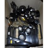 A quantity of ebony dressing table wares including brushes, candlesticks, tray, hatpin holders,