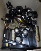 A quantity of ebony dressing table wares including brushes, candlesticks, tray, hatpin holders,