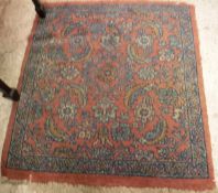 A Mahal rug, the central panel set with floral decoration, within a pink ground,