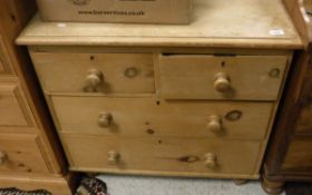 A pine chest of two short over two long drawers to turned feet