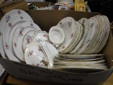 A collection of Spode Copelands china "Rose and Ribbon" decorated dinner wares with gilt rims