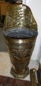 A late 19th Century embossed brass grape hod with lion and exotic beast decoration