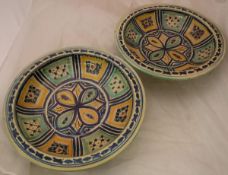 A pair of Iznik polychrome decorated bowls and a Japan pattern pottery salad bowl and servers with