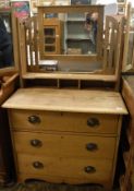 A circa 1900 pine dressing chest with mirrored superstructure above three long drawers to bracket