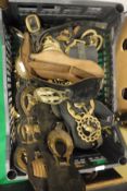 A box of various modern leather martingales and horse brasses
