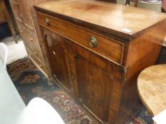 A 19th Century mahogany side cabinet with single drawer over two cupboard doors to splayed bracket