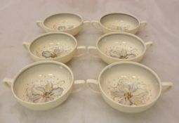 A set of six Susie Cooper crownworks flower head decorated two handled bowls numbered 2365 together