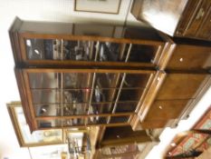 A 20th Century mahogany breakfront bookcase of small proportions in the George III taste,