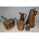 A collection of various mainly 19th Century copper wares to include large copper jugs, cooking pans,