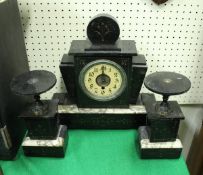 A 1930's black marble and grey-veined white marble clock garniture in the Art Deco style