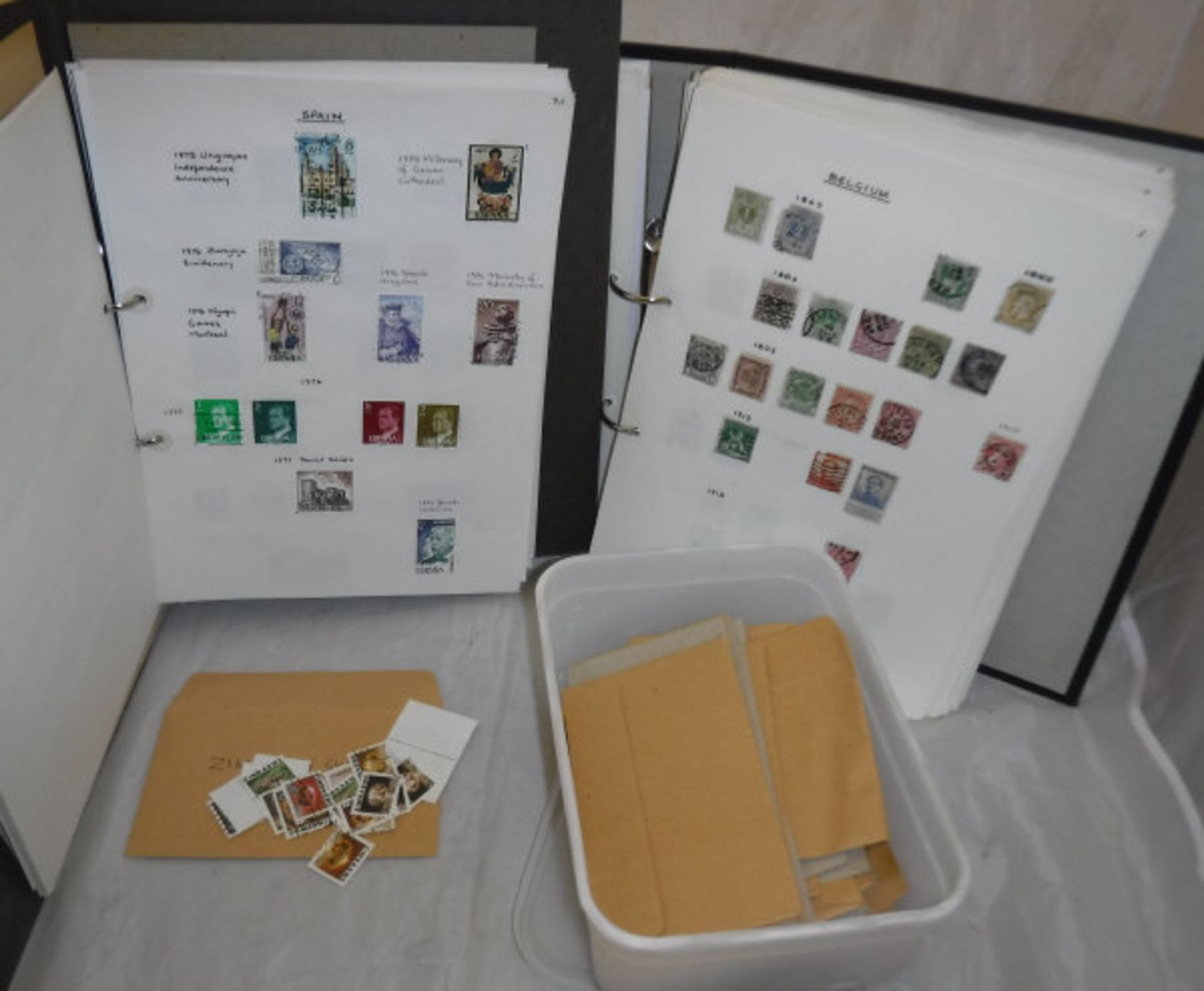 Four albums and a box of various British and World stamps