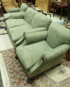 A Victorian three piece suite comprising two seat sofa and two armchairs,