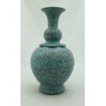A Chinese speckled turquoise glazed vase of gourd form with studded panelled shoulders and flaired
