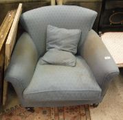 A Circa 1900 tub chair with scroll arms above square tapering legs to brass caps and china castors