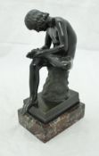 A 19th Century Continental bronze figure of Spinario,