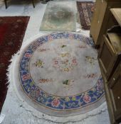 A Chinese superwash circular rug, the centre with flower-filled vase on a mushroom ground,