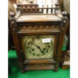 A circa 1900 walnut cased eight day mantle clock