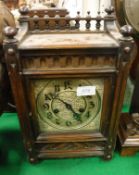A circa 1900 walnut cased eight day mantle clock