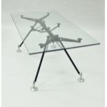 A glass and metal framed Nomos dining table designed by Sir Norman Foster for Tecno circa 1980-89