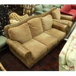 A modern leather and upholstered three seat sofa,