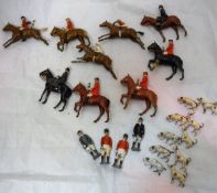 A collection of Britains huntsmen and hounds including five mounted huntsmen,