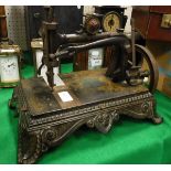 A Victorian Collier sewing machine on ornate bracket foot base