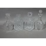 Four cut glass decanters,