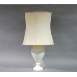 A white marble lamp of baluster outline with shade