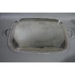 A silver plated two handled tray in George III style reel moulded border and acanthus wrapped