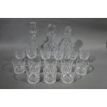 A large quantity of miscellaneous glassware including three cut glass decanters,