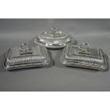 A pair of silver plated entrée dishes and covers,