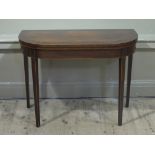 An early 19th century mahogany and cross banded card table inlaid with box and ebony stringing