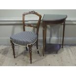 A Victorian walnut foliate carved and incised salon chair on turned legs,