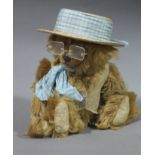 A honey plush Teddy bear by the English Teddy Bear Company of Bath with jointed limbs and boot