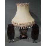 A reproduction table lamp with tasselled apricot shade;