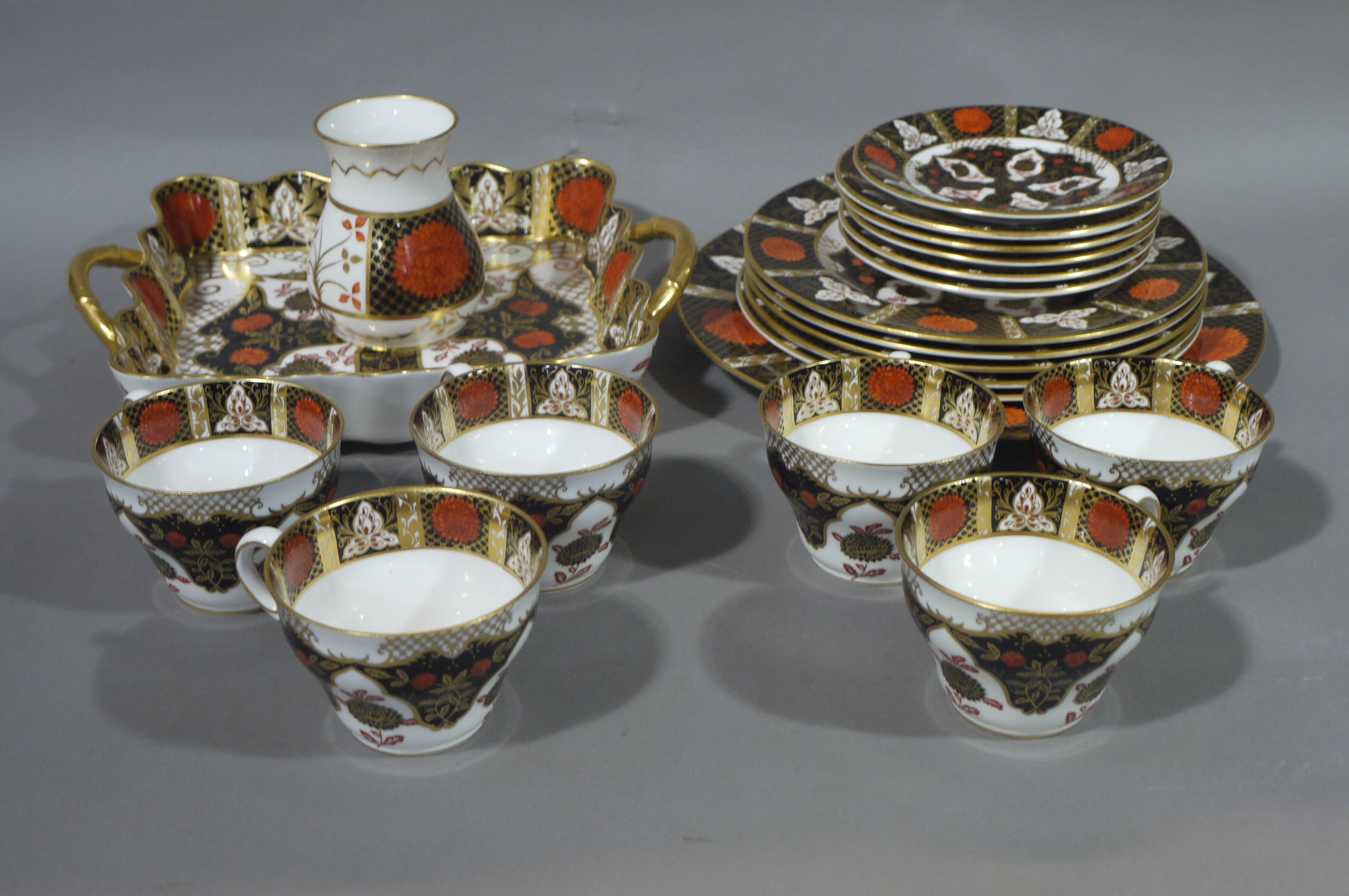 An Abbey Dale china tea service of Chrysanthemum pattern in iron red, black and gilt, comprising,