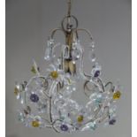 A glass and metal basket light fitting modelled as scrolling flower sprays