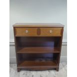 A mahogany G Plan two tier bookcase with drawer on bracket feet