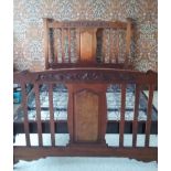 A late Victorian walnut double bedstead and springs,